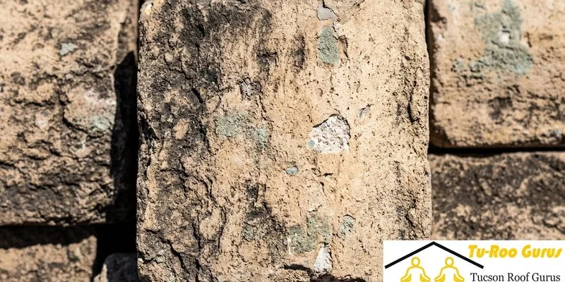 Close-up of aged concrete tile showing surface weathering from decades of Tucson sun exposure