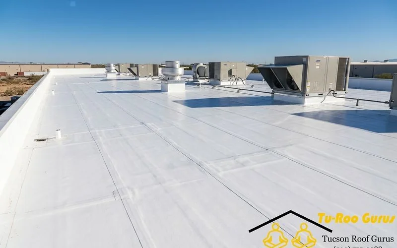 Reflective white flat roofing membrane installed on commercial building